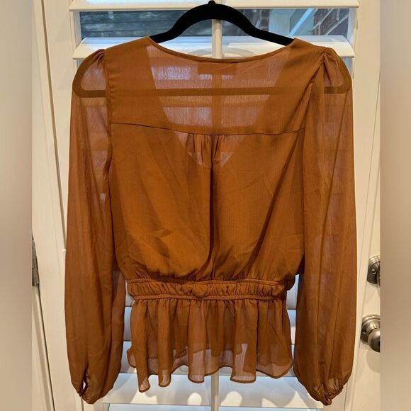 Very flattering long sleeve peplum sheer blouse. - Picture 2 of 2